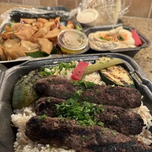 Shish kofta with rice, Fattoush salad, small hummus, + pita. Delicious!