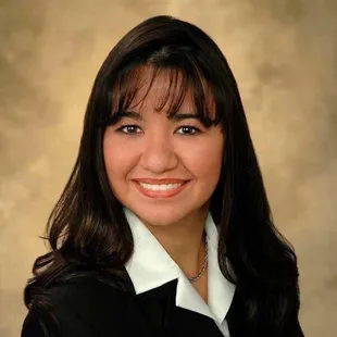 a woman in a black shirt and white collared shirt