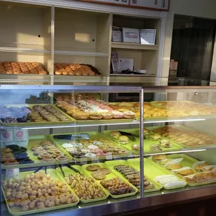 a display case filled with various types of donuts