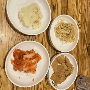 Side dishes - kimchi, fish cake, bean sprouts, mashed potatoes