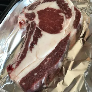 a piece of meat on a piece of tin foil