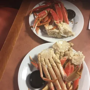 two plates of crab legs