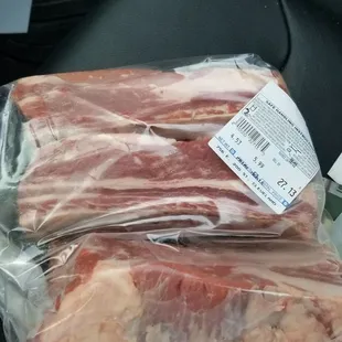 two pieces of meat wrapped in plastic