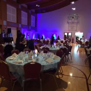 a banquet hall with tables and chairs