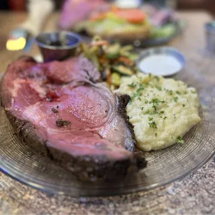 Thick and hearty Prime Rib Plate! Comes with Au jus, mashed potatoes, and sautéed veggies