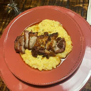 Braised Pork Belly over White Cheddar Corn Grits
