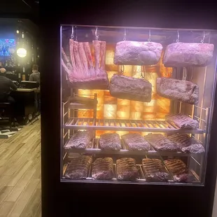a display of meats and pastries