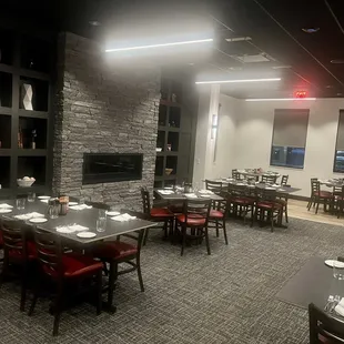 a dining room with tables and chairs