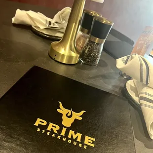 a menu and a knife on a table