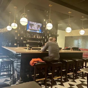 a man sitting at the bar