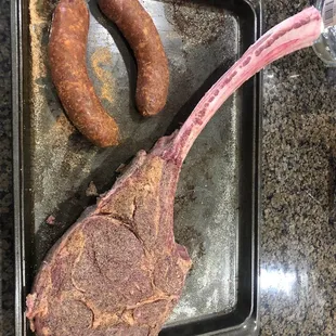 Tomahawk steak and mild barbecue sausage