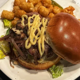 Beyond patty with mushroom and onion on a pretzel bun.