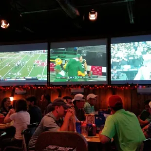 Prime Time Sports Grill has big-screen high-def flat-screens all over the place, plus individual speakers for your booth / table