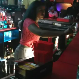 a woman behind the bar