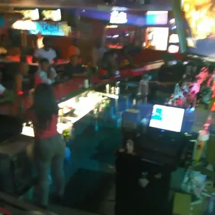 a woman standing in a bar