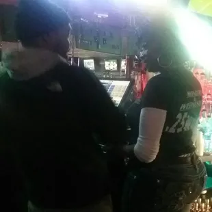 a man and a woman at a bar