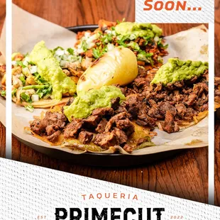 a plate of tacos with guacamole