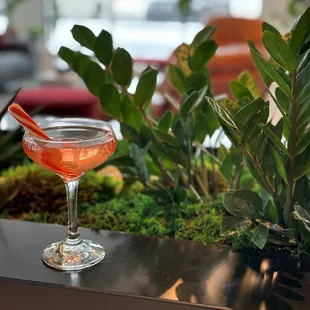 a cocktail in a glass on a table