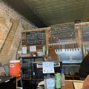 a woman sitting at a bar