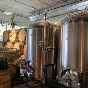 a row of stainless steel tanks