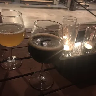 three glasses of beer on a table