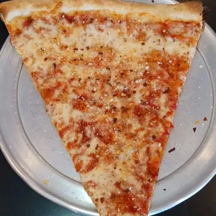 a slice of pizza on a plate