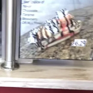 Blurry but it looks like a yummy banana split chocolate, caramel, strawberry or all 3:)