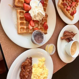 Belgian waffle with strawberries and whip cream