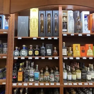 a shelf full of liquor