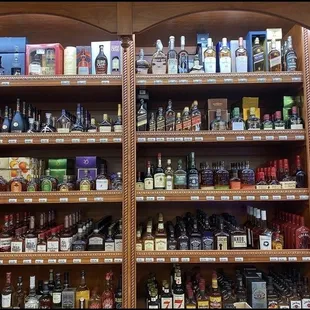 a shelf full of liquor