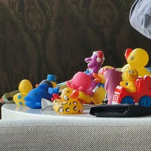 Saw a bunch of toys on a table.