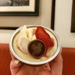 a person holding a bowl of food