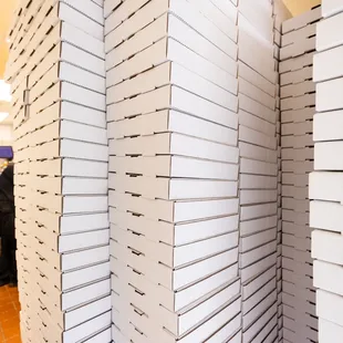 a stack of pizza boxes