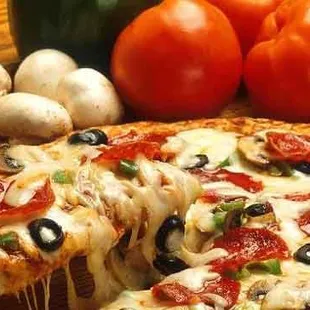 a slice being taken out of a pizza