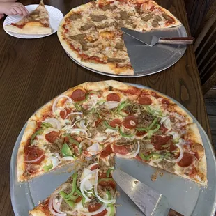 a pizza with a slice taken out of it