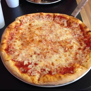 Pretty good pizza not too greasy. The size for the price is great id love to eat with a group here.