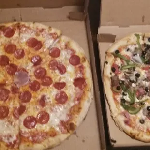 One large pepperoni and one medium supreme. Tip the drivers well because they are QUICK!