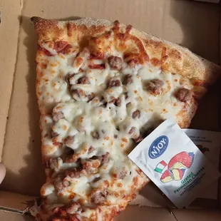 a slice of pizza in a box