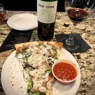 The Lorie Special: Slice of Primo, eggplant, &amp; ricotta w/ a side of sauce. Half off bottles of wine on Tuesdays!