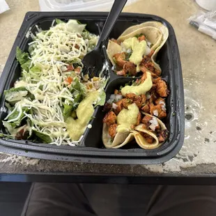 2 street tacos, rice, bean, and corn salad.