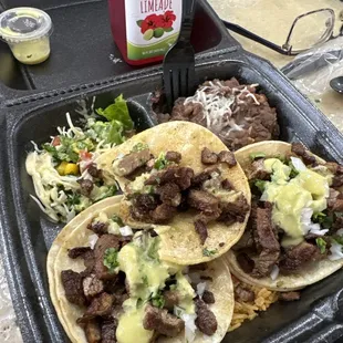 Carne asada tacos, beans, and cucumber and maiz salad, and a Hibiscus limeade drink!