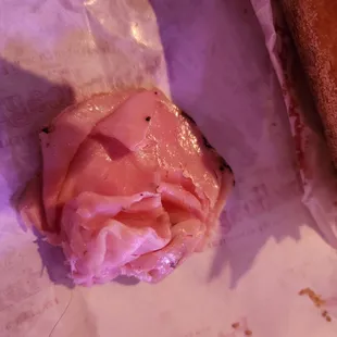 a half eaten ham sandwich