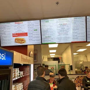 people ordering food at a fast food restaurant