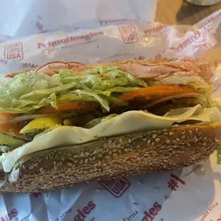 The Italian Primo with lettuce, tomatoes, peppers, mustard, onions, oil/vinegar and oregano blend.