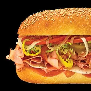 a sub sandwich on a black background