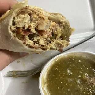 Emilio Am Burrito with bacon. Has potatoes, scrambled eggs, beans, cheese and hot salsa.