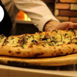 a pizza on a cutting board