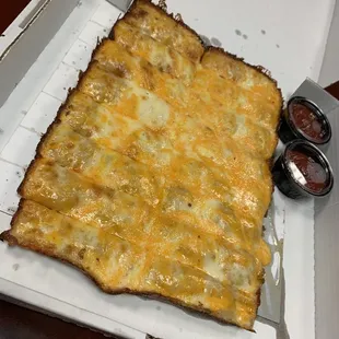 a cheesy pizza in a box