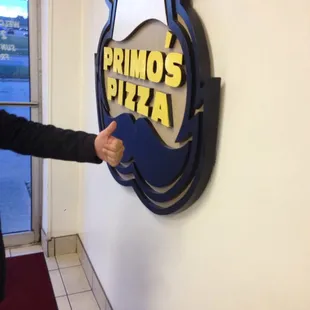 a man pointing at a sign