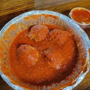 A side of meatballs.  They were flat on the bottom like they had been cut off.